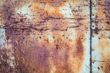 Rusty old scratched metal texture with seams and rivets, copy space