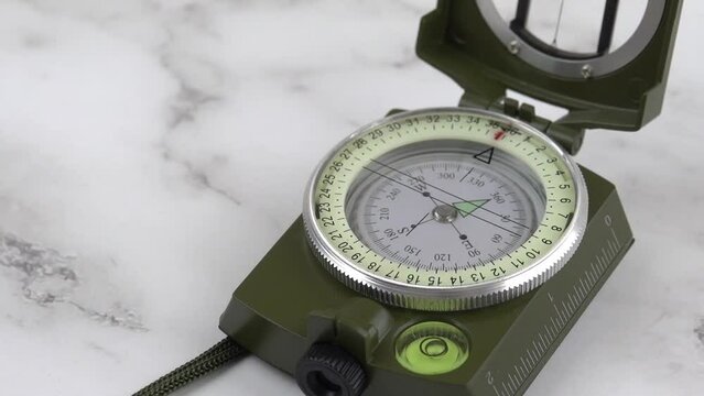 Compass needle orientating to magnetic course heading