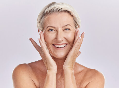 Portrait of a woman happy face smile with healthy skincare while posing in a studio against purple mockup studio background. Elderly woman doing her wellness skin cosmetic treatment routine