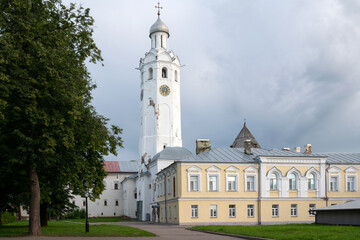 View of the Ioanovsky Building (19th c.) and The Clock Tower (17th c.) on the territory of the Novgorod Kremlin on a summer day, Veliky Novgorod, Russia