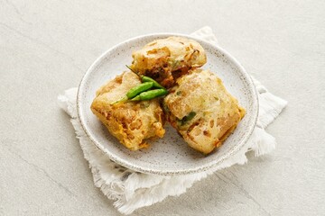 Deep fried stuffed tofu chopped mixed vegetables or called Tahu Isi, Indonesian traditional popular snack. Close up