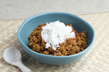 Tiwul, a traditional Indonesian food, is a staple food substitute for rice made from cassava. Usually eaten with a sprinkling of grated coconut. 