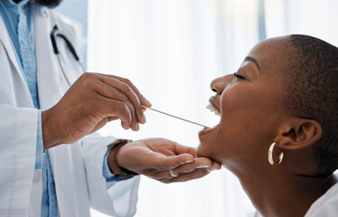 Doctor, otolaryngologist or dentist with a medical instrument checking the throat for tonsils or...
