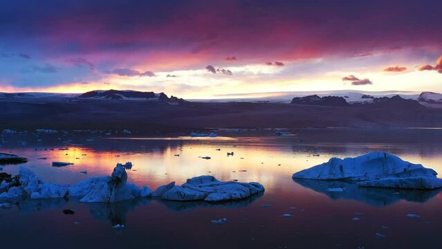 Aerial panoramic footage of sunset above J&ouml;kuls&aacute;rl&oacute;n glacier. Beautiful sunset landscape with horizon.