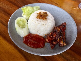 a plate of rice with sweet roasted duck
