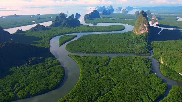An aerial view from a drone flying over Phang Nga Bay. Phang Nga Bay Tour, a popular tourist destination in the world. Phang Nga, Thailand. nature and travel concept. Hyperlapse. 4k
