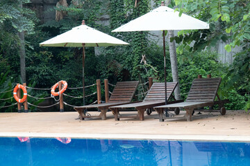 White Big Umbrella by the swimming Pool