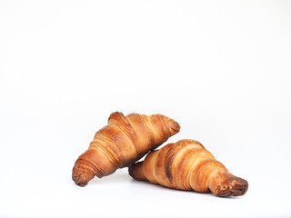 golden brown baked French butter croissants on white