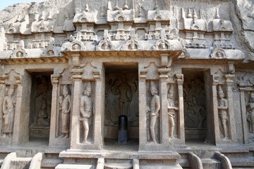 Fototapeta premium Rock cut cave temple with lingam carved in the rock. Monolithic ancient temple in Mahabalipuram, Tamilnadu.