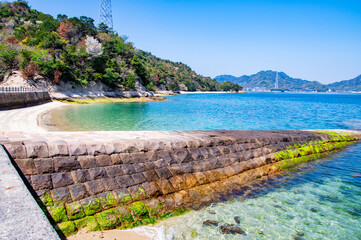 桟橋のある大久野島の美しい瀬戸内海の風景　広島県竹原市忠海町　Beautiful seascape of Setonaikai, Inland Sea of Japan, with stone pier on Okunoshima, known as "Rabbit Island" and "Poison Gas Island" in Hiroshima pref. Japan.