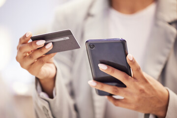 Ecommerce, fintech business woman with smartphone and credit card doing financial payment, online shopping or banking. Corporate finance hands using a secure and safe digital banking app or software