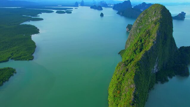 Another magnificent angle of beautiful a lot limestones peaks Islands in Phang Nga Province, Southern Thailand. tropical scenery during rainy season. aerial view from drone. geological wonder
