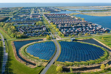 Modern sustainable neighbourhood in Almere, The Netherlands. The city heating (stadswarmte) in the district is partially powered by a solar panel island (Zoneiland). Aerial view.