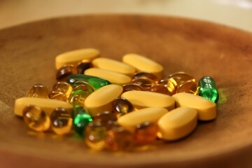 Medicines and Vitamins Tablets on a Brown Clay Plate