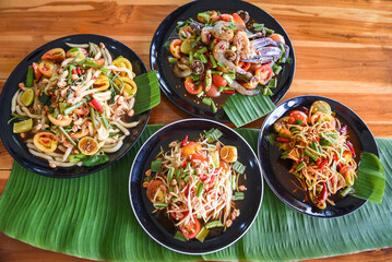 Thai food papaya salad served on table food, papaya salad spicy on plate with mix vegetables corn herbs and spices seafood shrimp crab noodles salted egg, Thailand Menu Asian Food