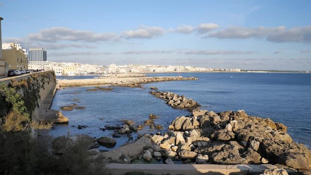 Waterfront in Gallipoli, Italy at Riviera Armando Diaz street and Seno del Canneto bay at sunset