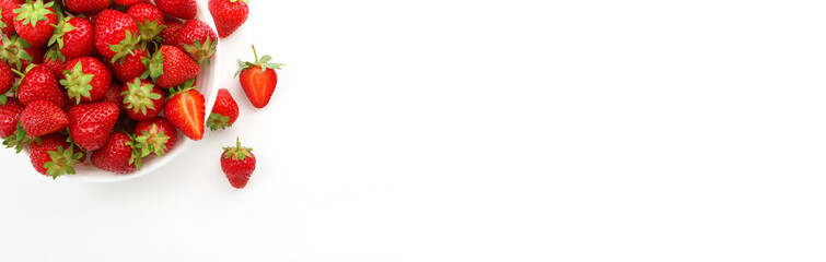 Red ripe strawberry in the white bowl