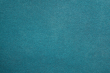 Blue panel with some fine grain in it. Blue glitter background