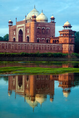 The Taj Mahal 'Crown of the Palace', is an Islamic ivory-white marble mausoleum on the right bank of the river Yamuna in the Indian city of Agra. It was commissioned in 1632 by the emperor Shahjahan.