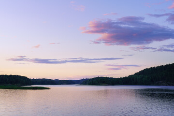 Beautiful landscape with a pond and a sunset sky