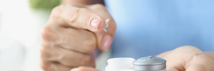 Fingertip contact lenses and storage box closeup