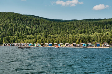 Fototapeta na wymiar Tent camp in village of Katun on coast Chivyrkuisky Bay of Baikal. Zabaikalsky National Park,Russia