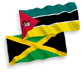 National vector fabric wave flags of Republic of Mozambique and Jamaica isolated on white background. 1 to 2 proportion.