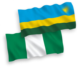 National vector fabric wave flags of Republic of Rwanda and Nigeria isolated on white background. 1 to 2 proportion.