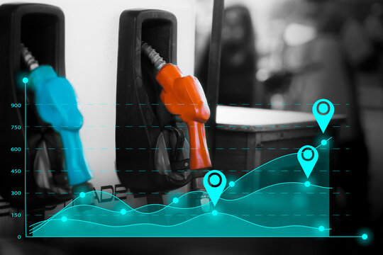 Graph of the stock market oil price with pump nozzle background. Concept oil trend up and down on market world. Oil shortage in market.
