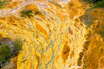 Environmental pollution from the extraction of copper ore and copper pyrite. View from above. Dead soil and forest. Martian landscape