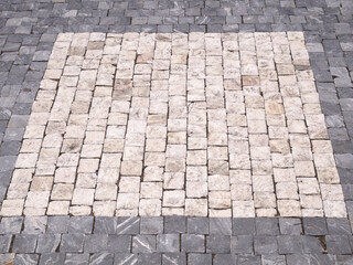 Granite paving stones on the square.