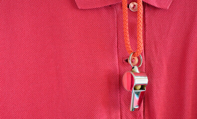whistle of a soccer referee or coach on red polo shirt,great soccer event this yeart,free copy space
