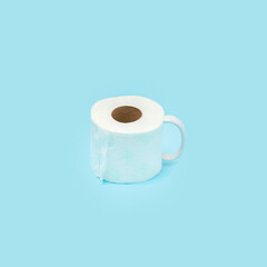 Toilet paper rolls like a cup on Blue background. Creative minimal concept.