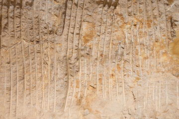 mechanic excavator teeth marks of an excavator on a quarry rock face