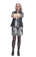 happy young woman holding out a gift box. isolated on a white background