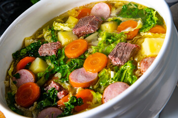 delicious savoy cabbage soup in white vase