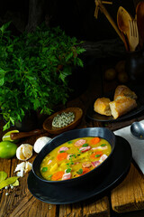 Hearty rustic pea soup with bacon and sausage