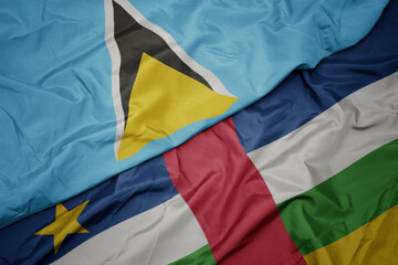 waving colorful flag of central african republic and national flag of saint lucia.