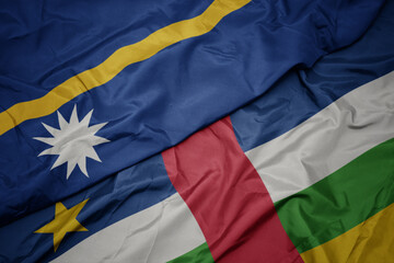 waving colorful flag of central african republic and national flag of Nauru .