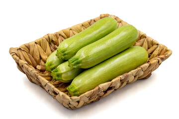 Organic zucchini. Fresh zucchini in basket isolated on white background. Vegetable, healthy vegan food. close up