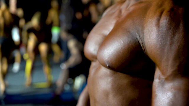 bodybuilder. body part details. bodybuilder in competition, detail. 4k video.