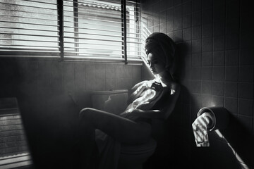 black and white young asian women model sitting poses naked by the window light in bathroom, lady...