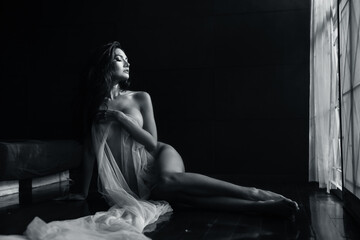 black and white young asian women model sitting poses naked by the window light only a thin curtain...