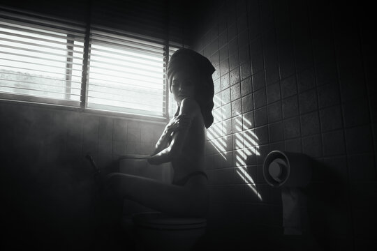 black and white young asian women model sitting poses naked by the window light in bathroom, lady sexy emotion of art
