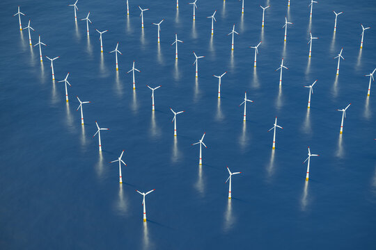 3D rendering: Photorealistic image of an offshore wind park in the sea.
