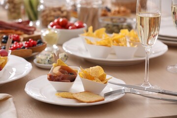 Variety of snacks on wooden table in buffet style