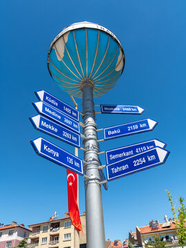 Akşehir, Turkey - July 04, 2022: Akşehir Nasreddin Hoca Square, the Infidel Measures Monument and the distance sign to different cities on it
