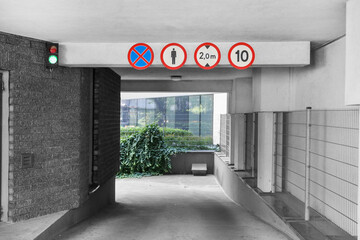 signs at the entrance to the underground parking, underground parking entrance
