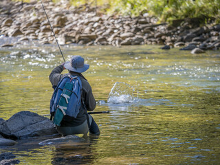 Man fly fishing.