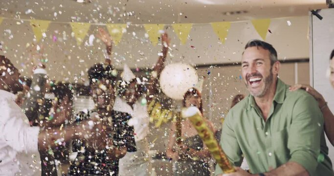 Confetti, party and team or friends celebrating and having fun and laughing together at a birthday house party. Happy group of people in celebration with smile for moments of years working together.